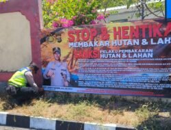 Upaya Mencegah Kebakaran, Kapolsek Kubu Pasang Spanduk Himbauan Waspada Kebakaran Hutan dan Lahan Kering