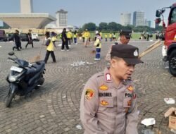 Sesuai Arahan Kapolri Personel Polri Sigap, Bersih-bersih di Kawasan Monas Usai May Day Fiesta