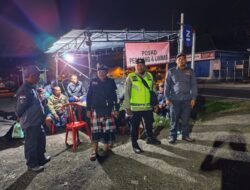 Bhabinkamtibmas Desa Nongan Bersinergi dengan Linmas dan Pecalang, Melaksanakan Pengamanan Pada Kegiatan Masyarakat