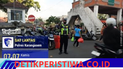 Utamakan Keselamatan Pejalan Kaki, Personel Lantas Karangasem Bantu Sebrangkan Warga Menuju Pasar Ksatrian, Amlapura