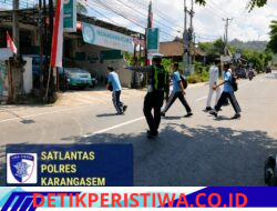 Utamakan Keselamatan Kalangan Pelajar, Satlantas Polres Karangasem Rutin Bantu Sebrangkan Siswa SMAN 1 Amlapura