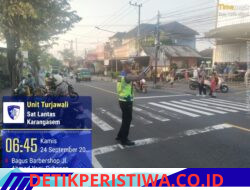 Cegah Lakalantas Terhadap Kalangan Pelajar, Anggota Lantas Polres Karangasem Bantu Sebrangkan Siswa-siswi SDN 1 Subagan 