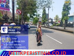 Utamakan Keselamatan Kalangan Pelajar, Personel Satlantas Bantu Sebrangkan Siswa-siswi SMPN 2 Amlapura